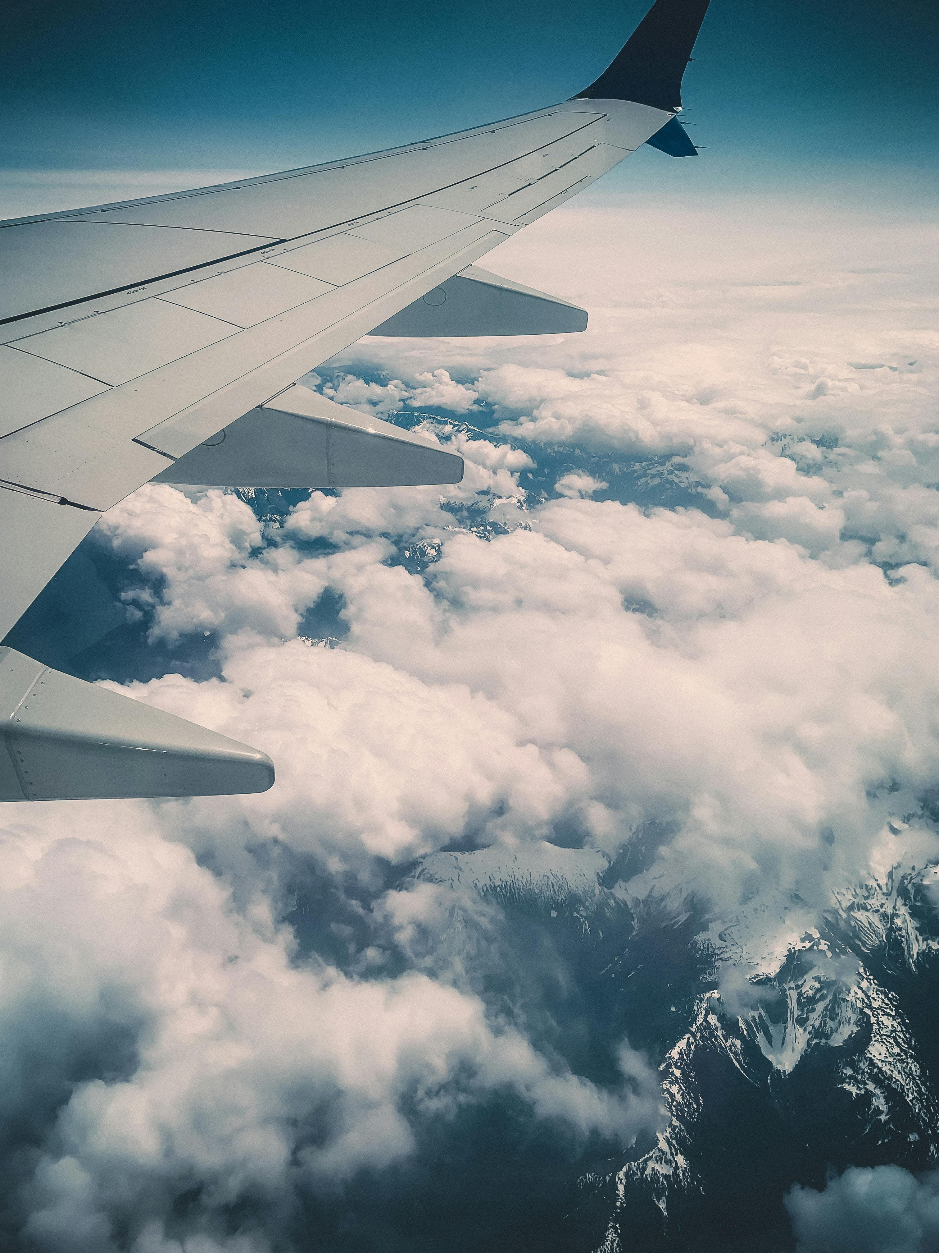 Aerial view of aircraft wing — international travel and global communication